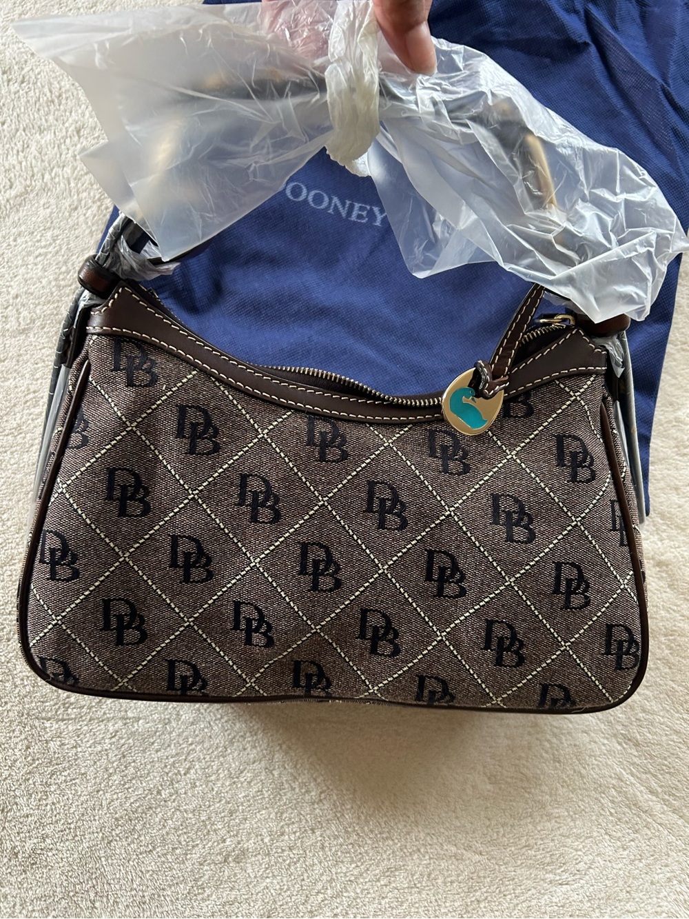Dooney & Bourke Brown Logo Jacquard Shoulder Bag with Teal Charm